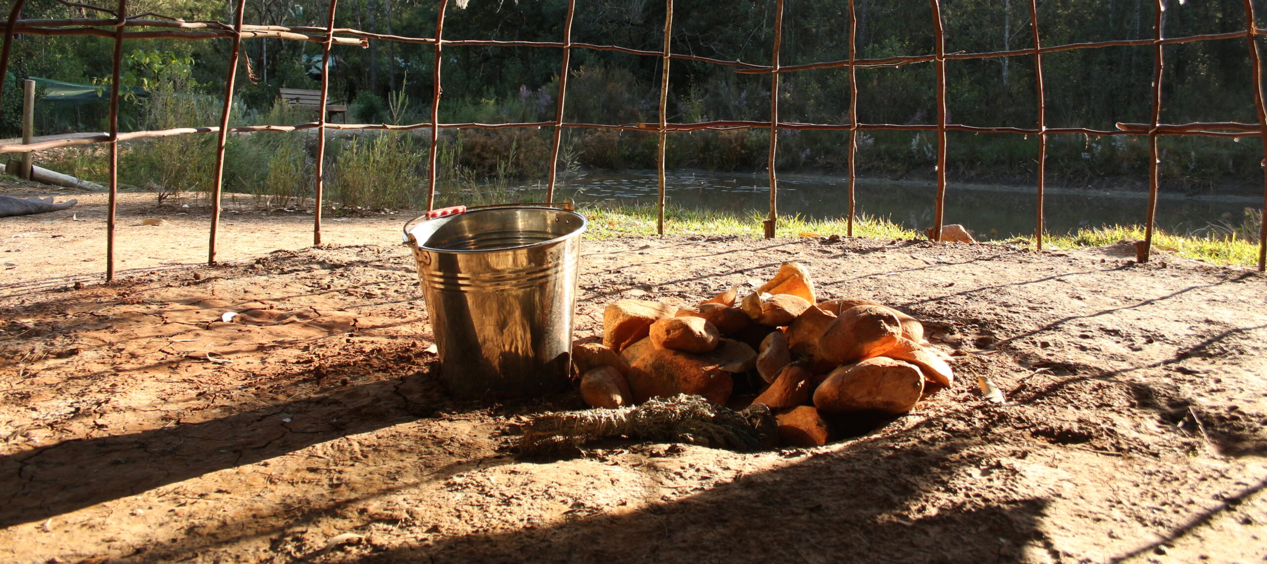 Stones and water inside the lodge frame