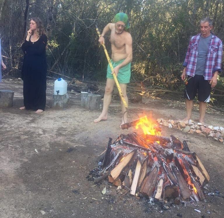 Nixiwaka tending the fire