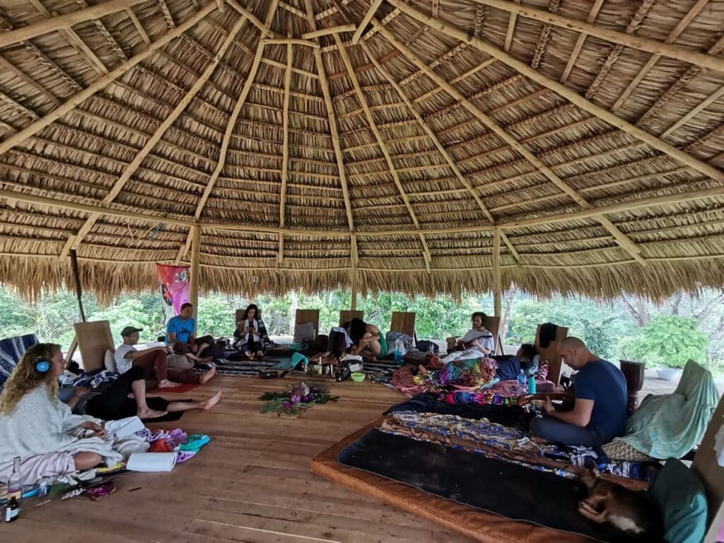 A gathering under a thatched roof
