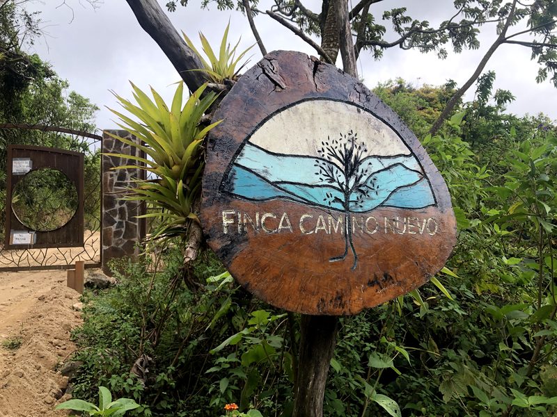 The Finca Camino Nuevo sign at the gate in Monteverde